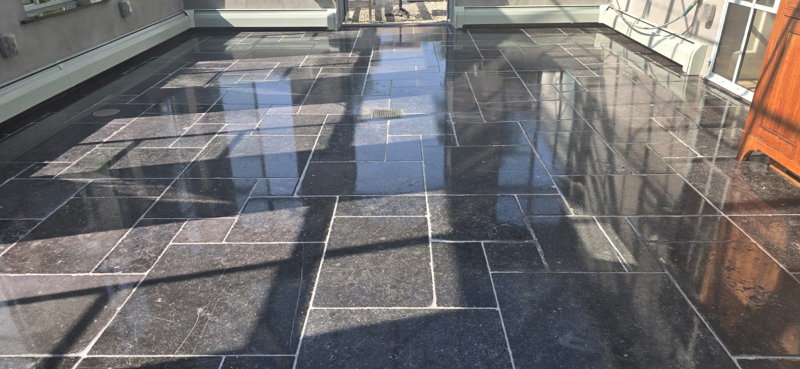 Dark stone tiles professionally polished